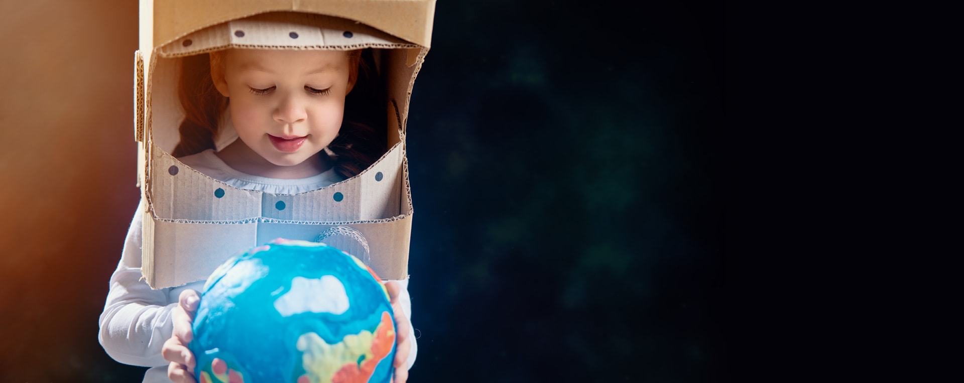 Boy holding globe